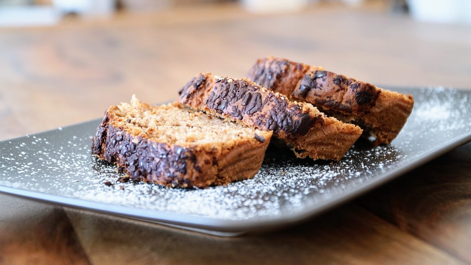 Slices of banana bread arranged on a metal tray